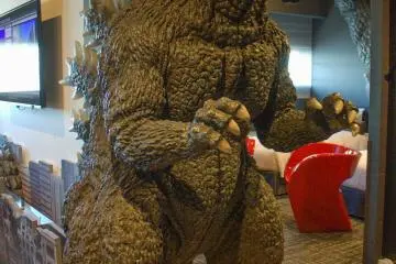Human-sized Godzilla welcomes you
