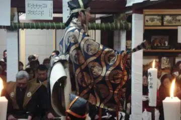 Performers, including this boy, wear elaborate costumes