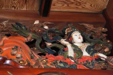 This beauty is posing in a temple fresco-all but otherworldly