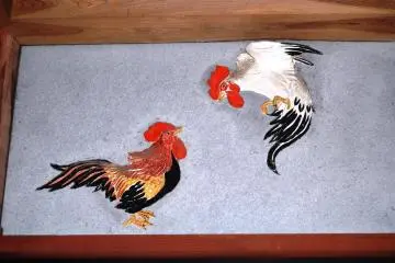 The fighting cocks are probably a scene from some gambling places that Ishikawa used to visit