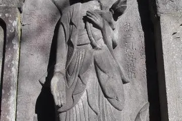 One of the carved figures on the big grave