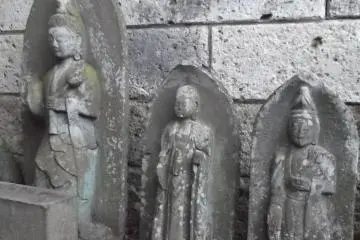Behind the big statue