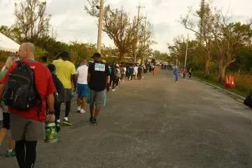 Runners lining up to take shuttle bus to start area