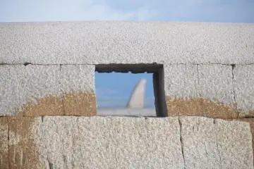 The pretty beach is dotted with concrete art works.