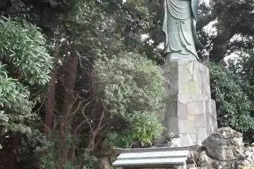 She stands tall and high on a plinth