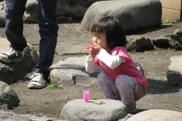 A girl making bubbles