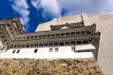 The temporary structure towers over this castle wall