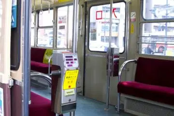 The inside of these old classic trams have plush velvet seats and style of days far gone.