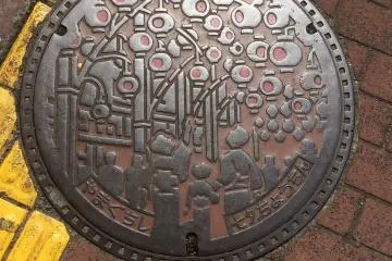 Yamaguchi City has a wide range of manhole covers including this one of a summer festival with lanterns