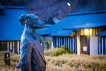 The standing dog statue of the distinctive Ramune Onsen