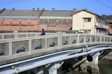 A bridge over the Miyauchi River near the sea.