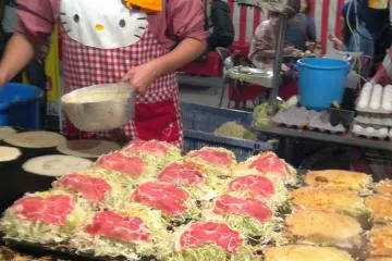 Okonomiyaki is just one of the many foods available outside during the festival