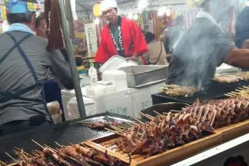 Another food option is grilled seafood (all types!) on a stick!
