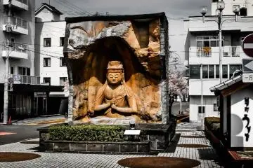  Even before reaching the valley's Stone Buddhas you are given a taste of things to come as you step outside the station 