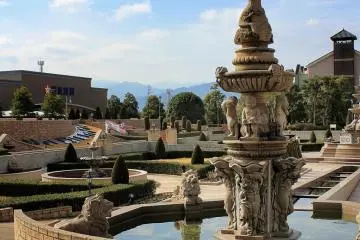 Beyond the ornate fountains you can see Mt. Ishizuchi in the distance