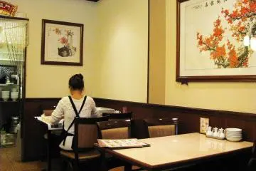 In the corner the woman was making gyoza
