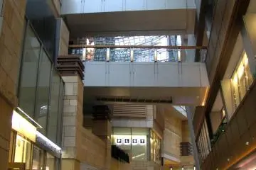 Lower floors containing different shops and restaurants