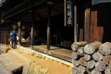 Old brickwork and a shop selling straw hats