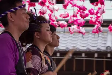 Taiko drummers perform on a float