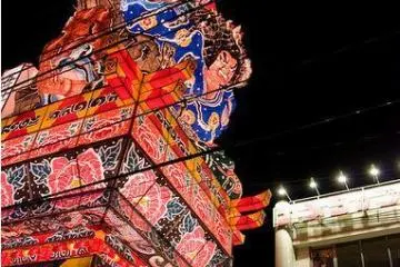 The floats are navigated down narrow streets lined with power lines.