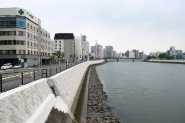 Tenma River, flanked by open walkways and parkland.