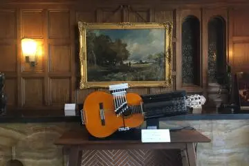 One of Masao Koga's guitars showcased in the recreation of his living room