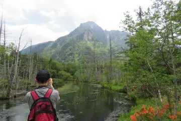 Taking pictures of Mt Myojin-dake and pond