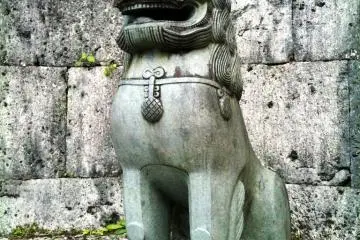 Ancient Shisa Statue guards Shuri Castle a world heritage site in Naha Okinawa