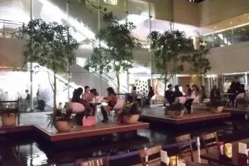 <p>Indoors on the fifth floor, yet outside by the water</p>