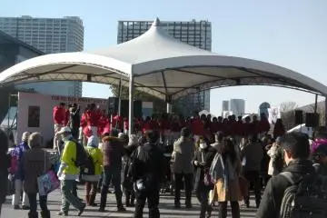 Singers entertain the crowd outside Tokyo Big Sight