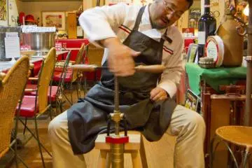 Mr. Takaji demonstrates a pasta-making handtool
