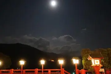 Under the full moon. In the distance, a 10m high torii gate