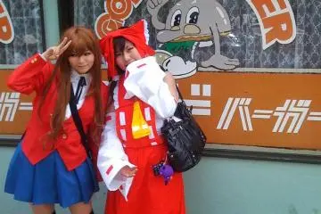 Cute Cosplay Couple in front of (old style) God Burger