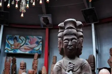 Inside the mandala sphere. This deity has four faces