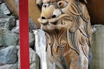 One of the lions that supports the sphere of the madala building