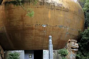 The now-tarnished gilded ball of the mandala