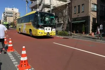 The sweeper bus slowly creeping in