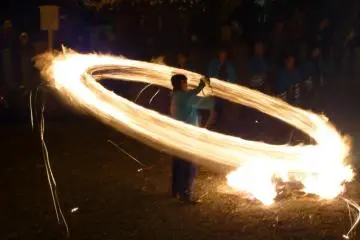 A festival participant swings a fiery torch at the annual Hifuri Shinji at Aso Shrine (Photo: Paul Bartok)