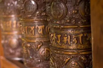 Inside the Kyozo, are a series of Tibetan Buddhist prayer wheels, said to imbue those who spin them with the same virtues as reciting the sutras