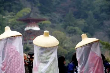 In their distinctive "monomoude" dress.