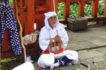 You may meet some white-clad pilgrims praying at the shrines on Haguro-san.