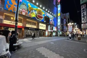 Oversized Cartoon Characters like Karl Ojisan lure us into a night fantasy that is adult and childlike at the same time at Dotonbori
