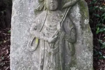 One of many small, weathered Buddhist monuments