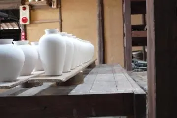 <p>Vases ready to be baked in the oven at the Kakiemon pottery</p>