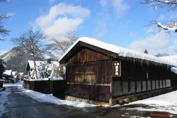 Winter: Buildings in the town are softened by the fresh snowfall.