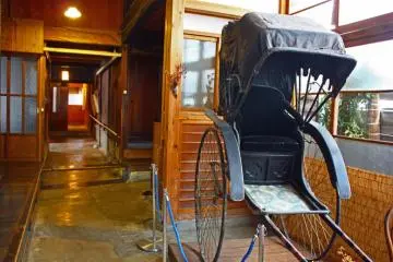 A Meiji-era rickshaw is one of the interesting objects on display.