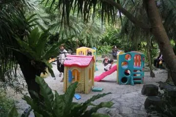 <p>Children take a break at a mini playground at the Mini Mini Zoo and Zukeran Egg Outlet in Uruma City Okinawa.</p>