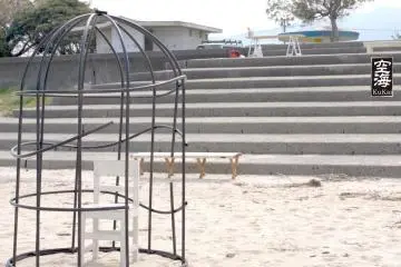A chair in a cage, or a table on the steps, just two of Umi to Cafe's seating options
