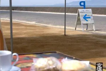 Overlooking the ocean with a coffee and bread at Umi to Cafe