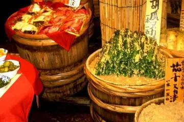 Massive barrels of miso pickled cabbage and other veges in every direction at the Nishiki Markets the Kitchen of Kyoto